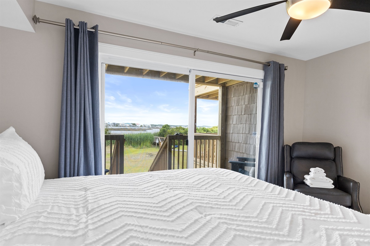 Wake up to serene water views right from the king bed
