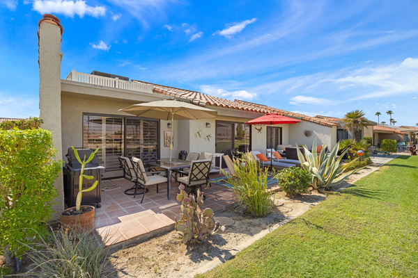 Spacious back patio with ample seating