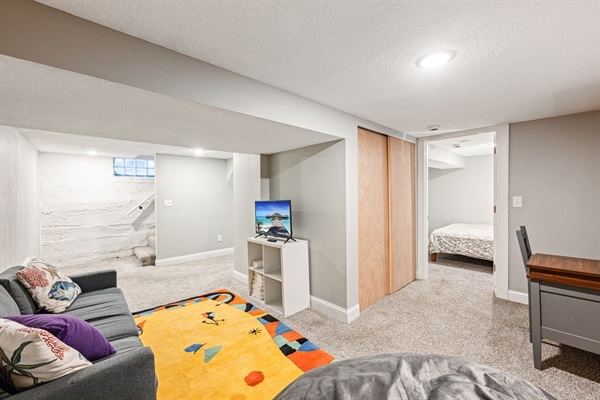 Basement family room with television