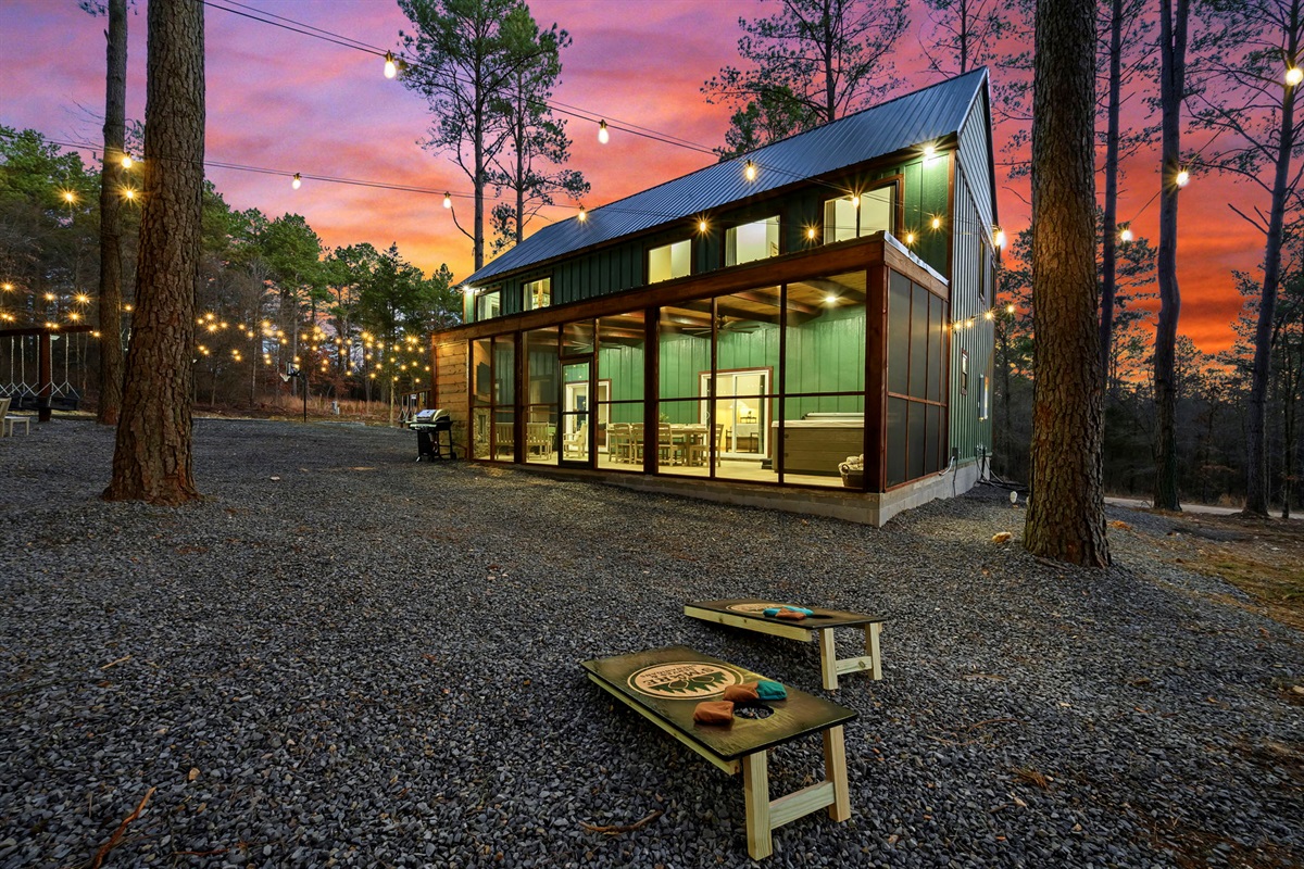 String lights + cornhole + screened porch vibes 🌅 &mdash; outdoor living done right.