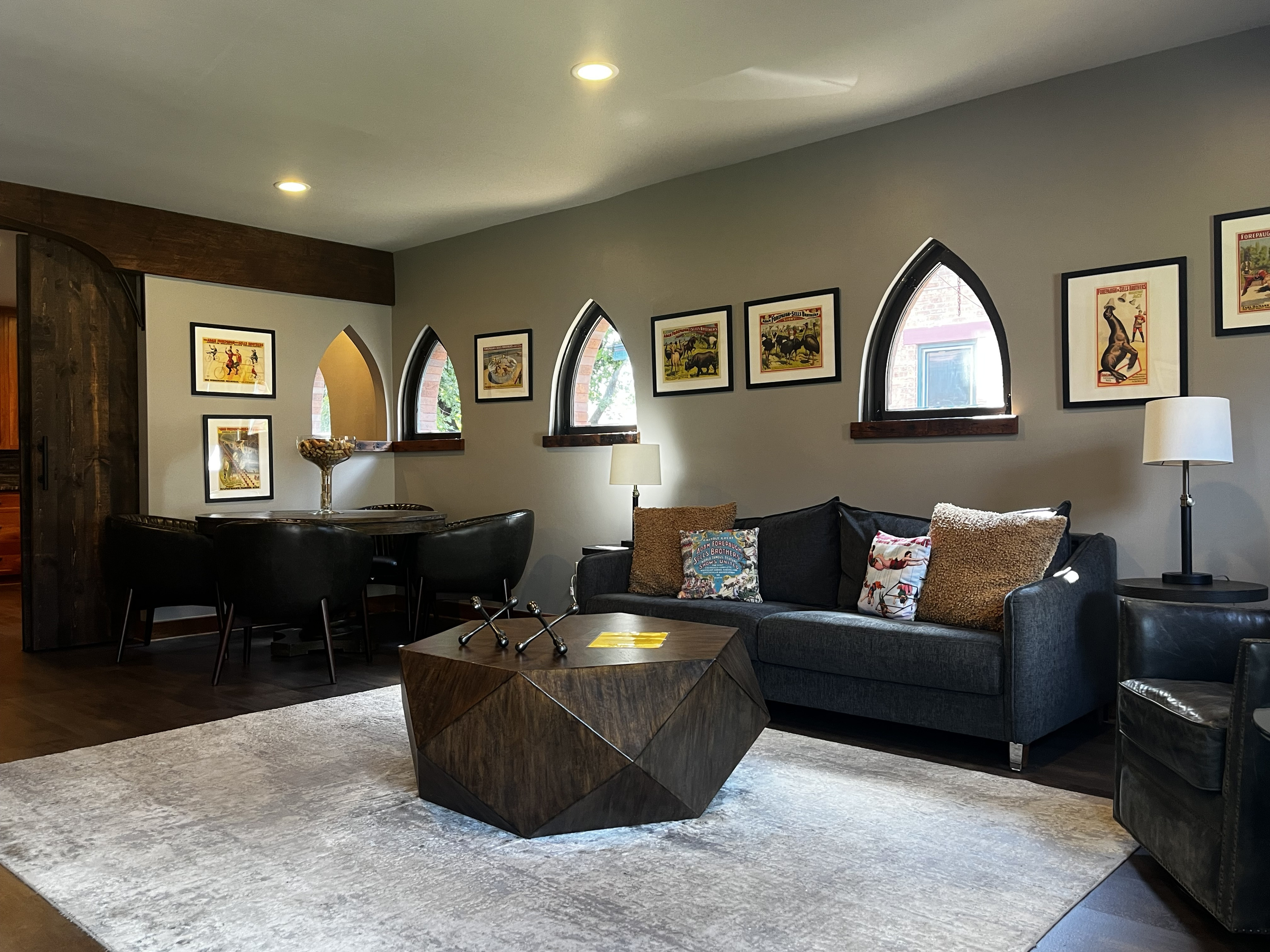 Living and dining area with the King sleeper sofa and vintage circus posters