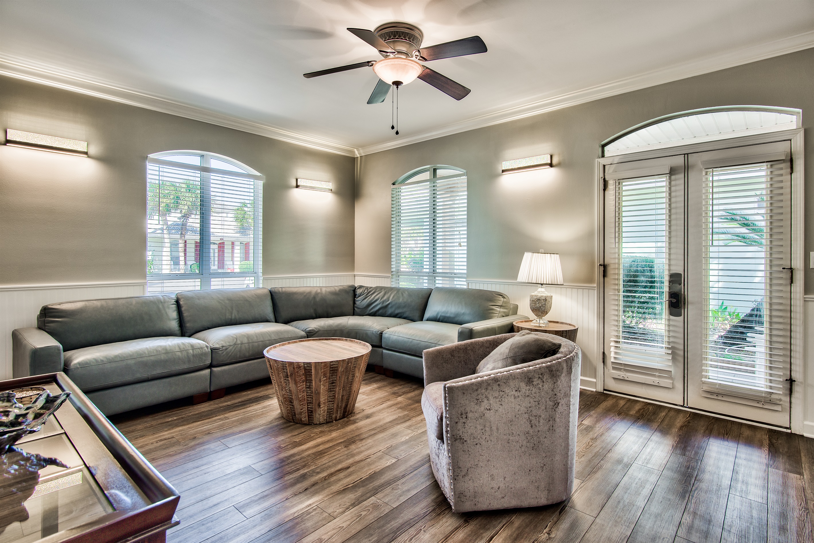 Open‑concept living area with vaulted ceilings and abundant natural light
