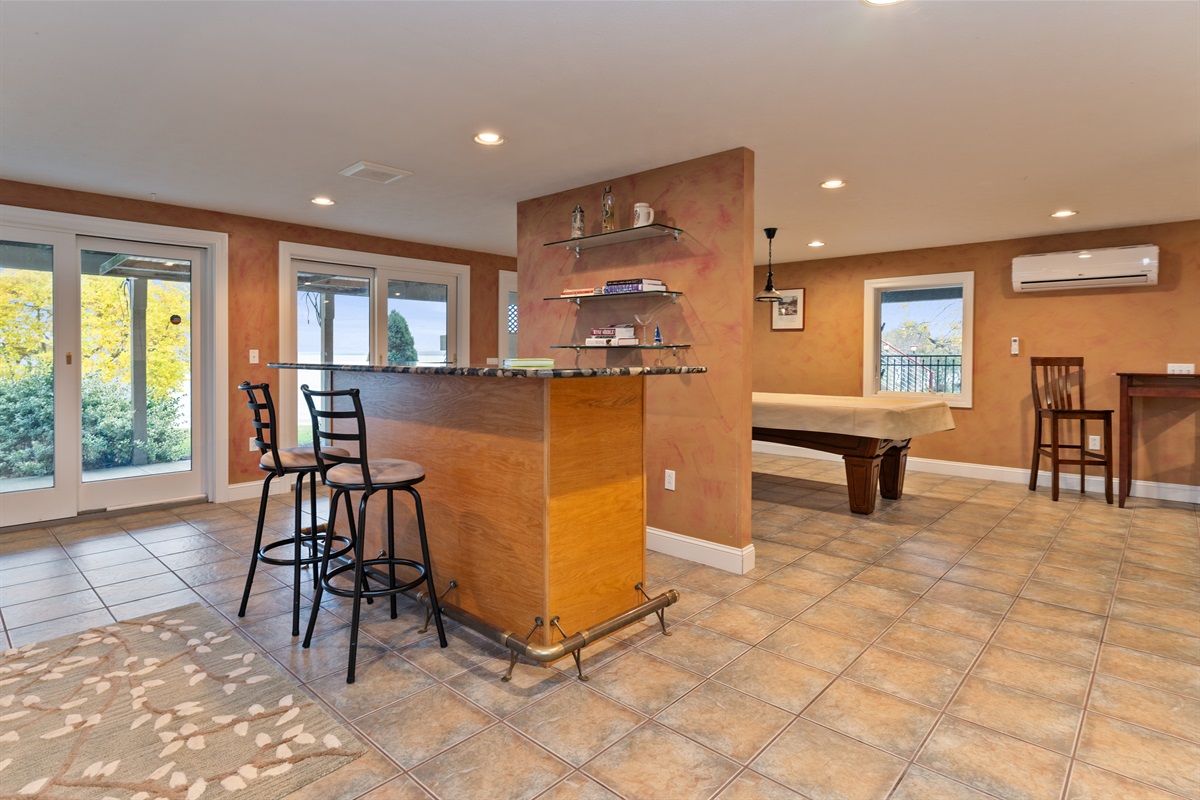 Lower level living room with bar and pool table