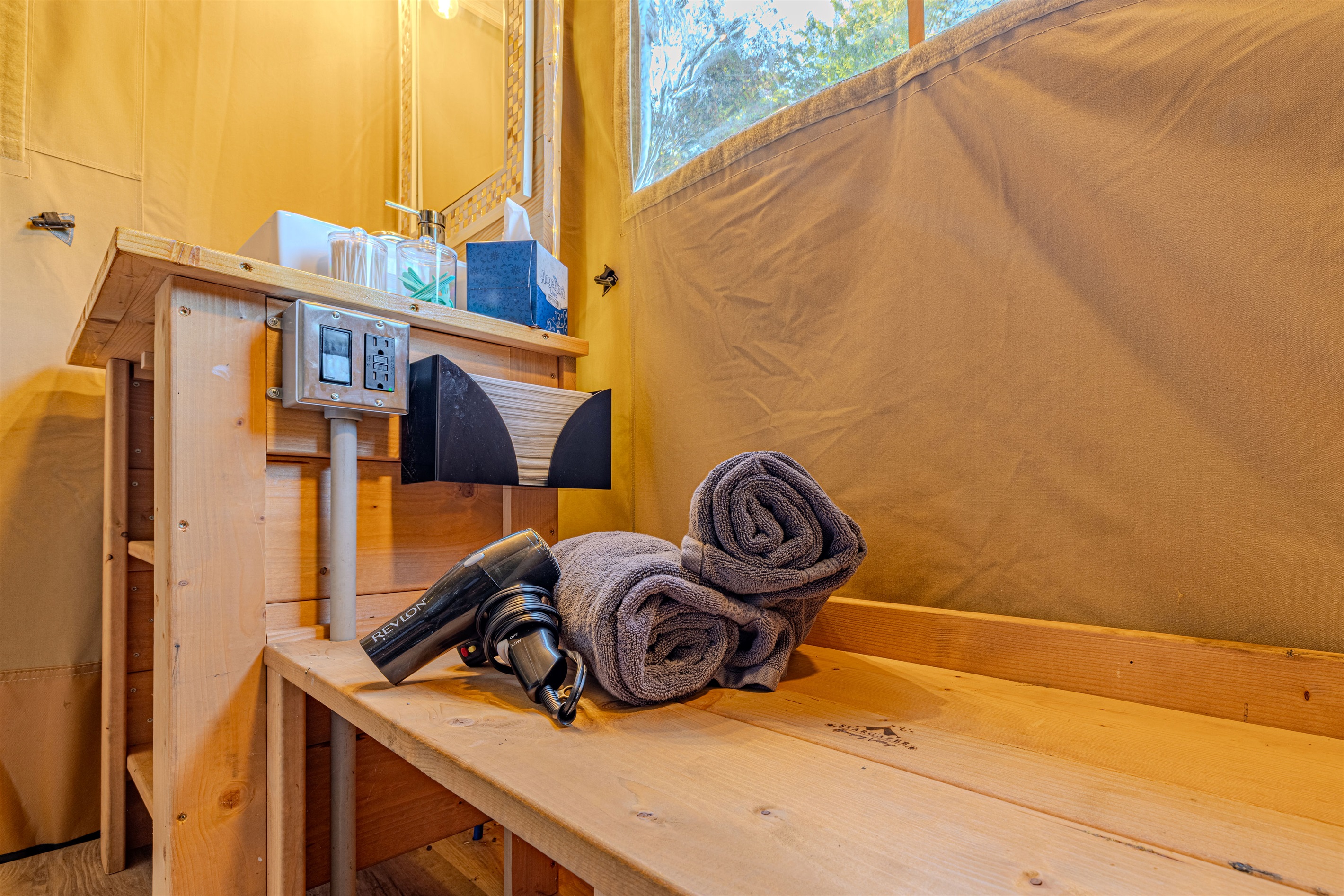 Modern convenience built right in. This sturdy wooden bench offers a practical spot to sit, set your bags, and find your included amenities, all inside your bath cabinet.