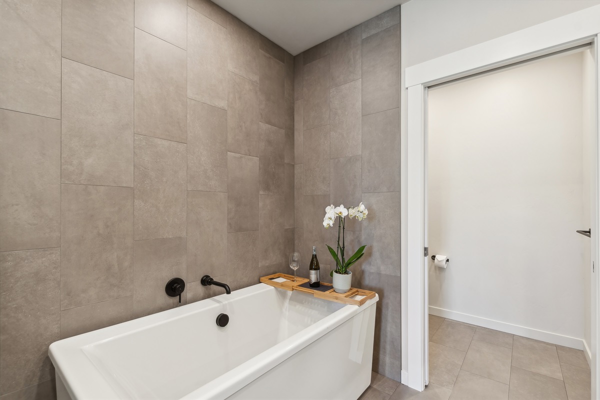 Enjoy a book or a glass of wine in the soaker tub