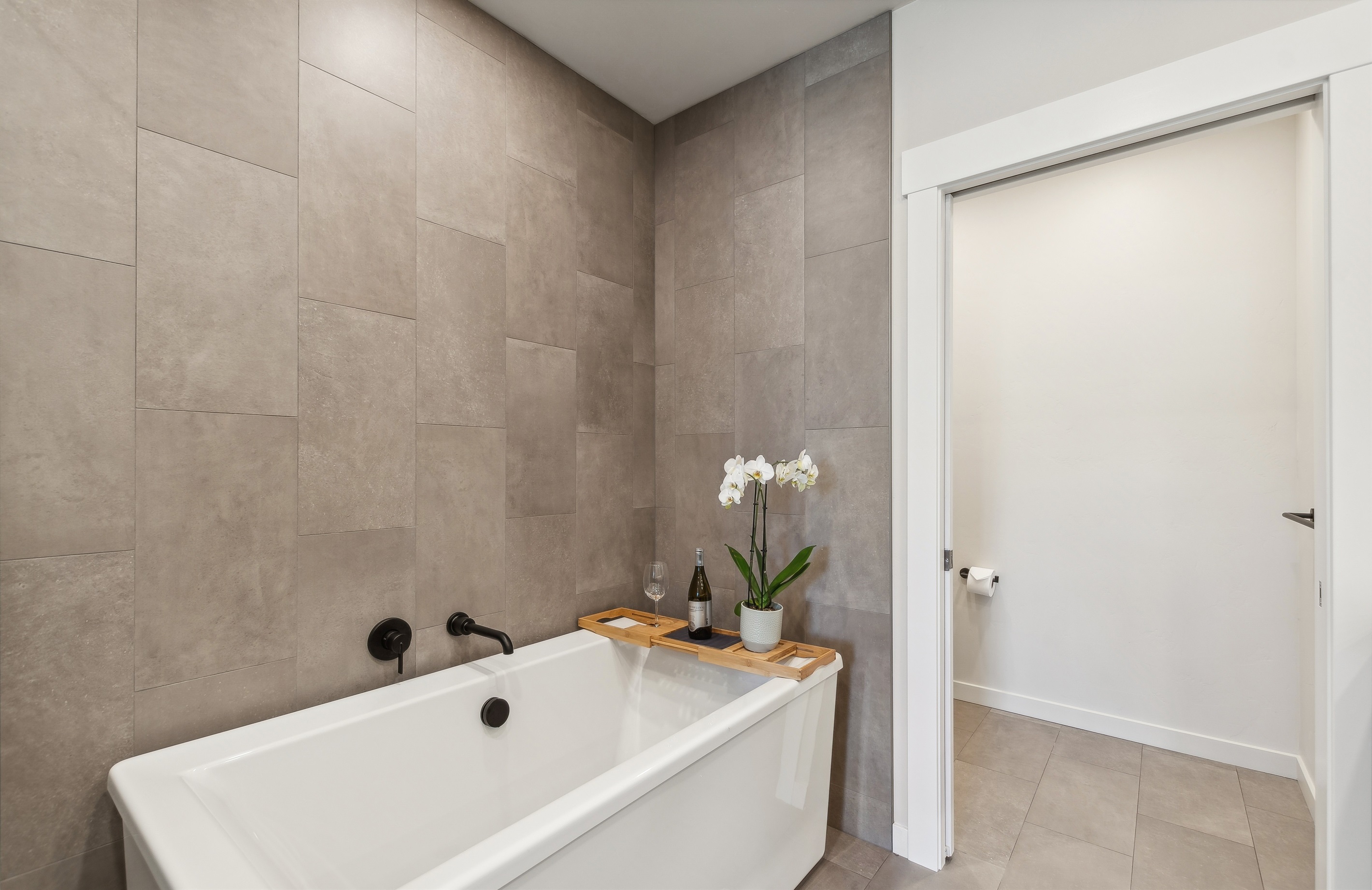 Enjoy a book or a glass of wine in the soaker tub