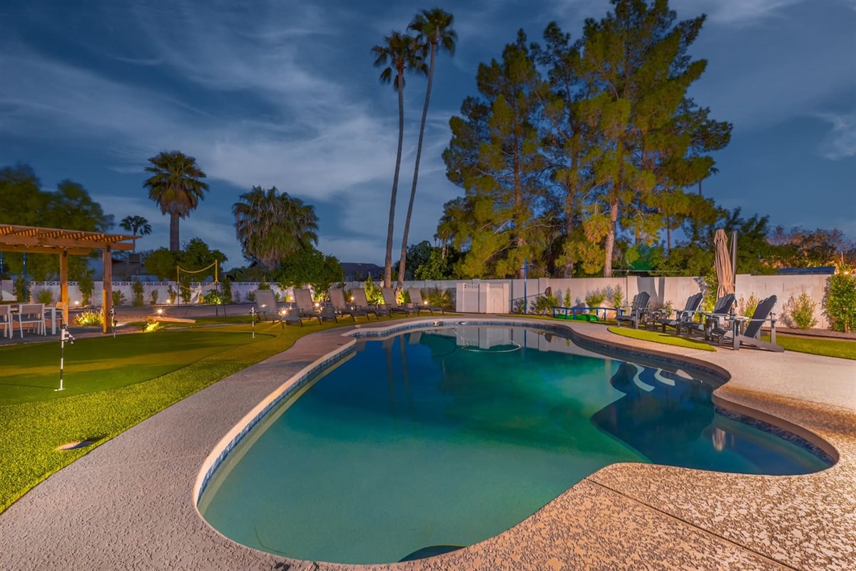 Relax by the heated pool, where a variety of seating choices ensure everyone finds their perfect spot to unwind.
