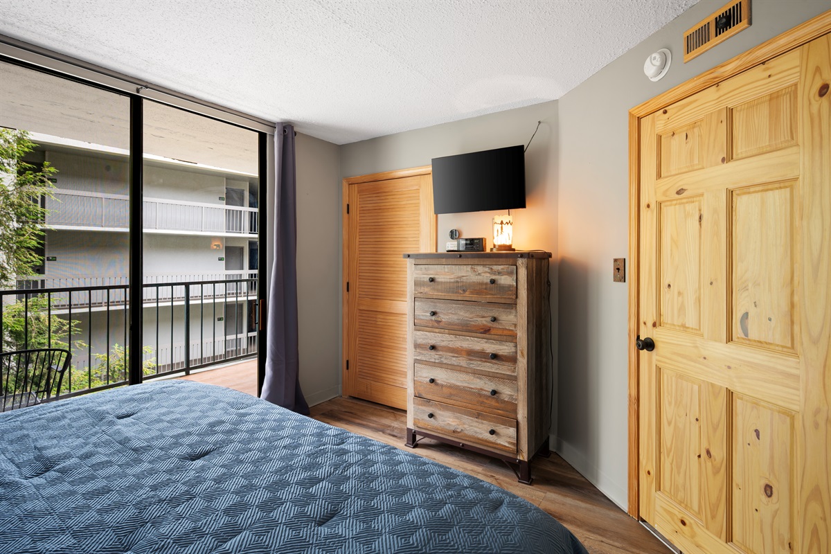 Bright and inviting bedroom with flat-screen TV