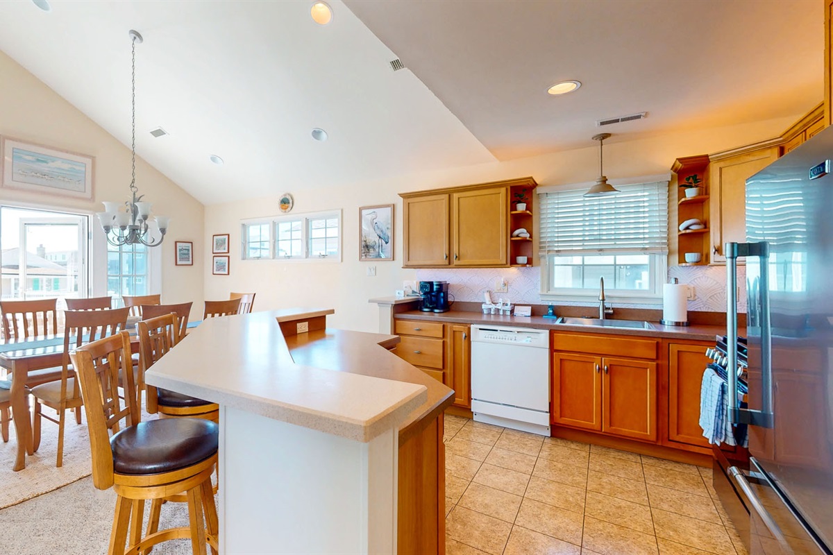 Kitchen area and kitchen island which can seat two