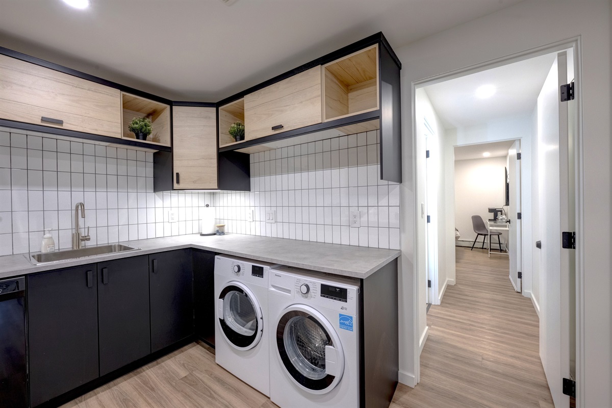 Laundry area conveniently located within the suite.