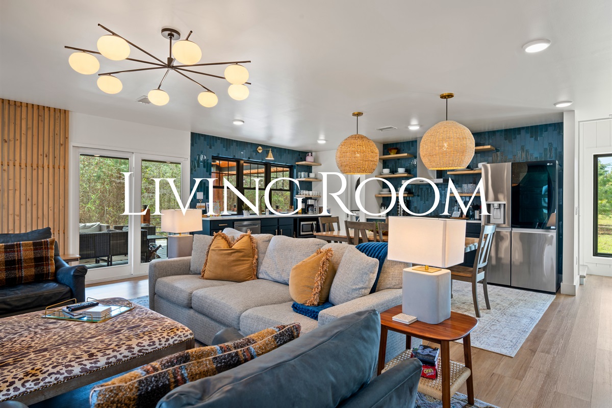 Natural light pours into the living room, highlighting the comfortable seating, thoughtful décor, and open layout that invites everyone to relax and settle in.