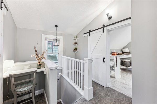 Upstairs common area with cozy little desk and workspace