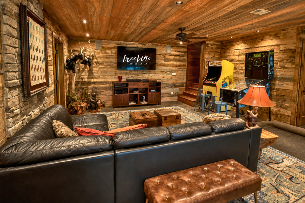 Sink into the leather seating and enjoy another comfortable gathering space, complete with a mounted TV and plenty of room for relaxed evenings indoors.