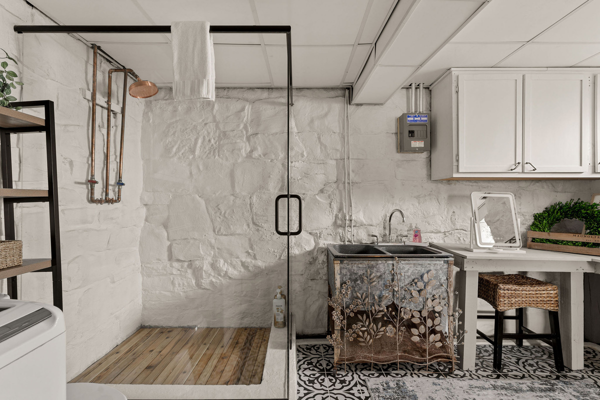 This gorgeous new glass-enclosed shower gave our lower-level bathroom a serious upgrade.