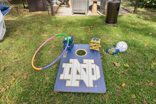 Pregame or playtime perfection—our fenced South Bend backyard features an ND cornhole board, football, soccer ball, and hula hoop. Family-friendly fun just minutes from Notre Dame.
