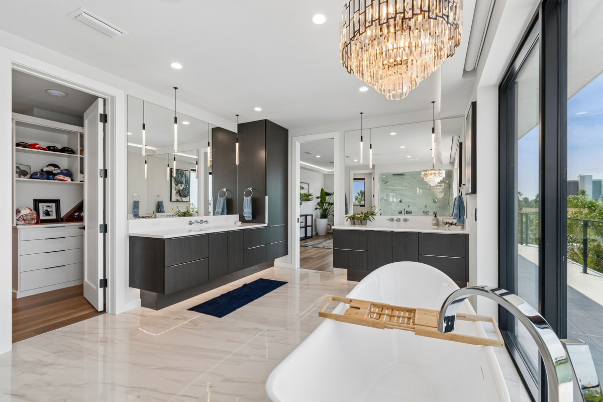 The Master bathroom is truly a sanctuary with a soaking tub with a view of the water and steam shower 