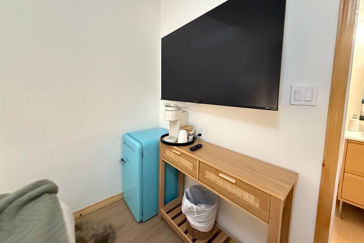 58” smart TV ready for you to streaming platform and watch your shows. A Keurig to brew morning coffee and a mini-fridge for your use.