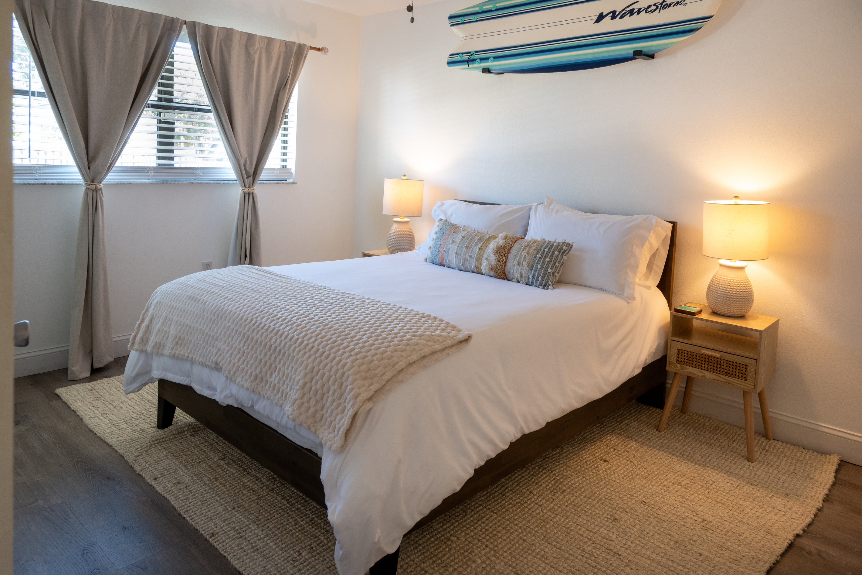 Bedroom 2 – cozy queen with rattan nightstands