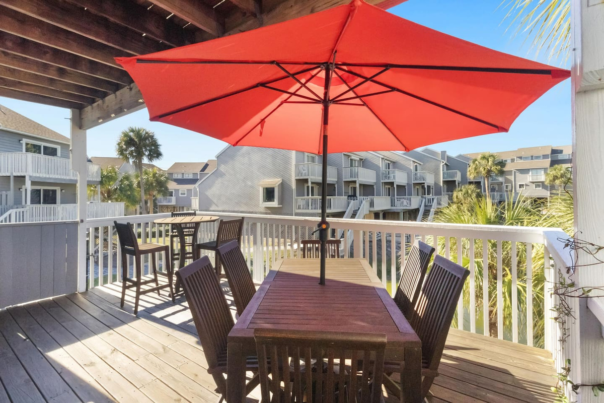 Your full-size main deck is set up and ready: outdoor furniture, Gulf views, and the kind of afternoon that goes too fast.