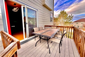 Cozy patio with seating for five, perfect for enjoying the outdoors with friends or family