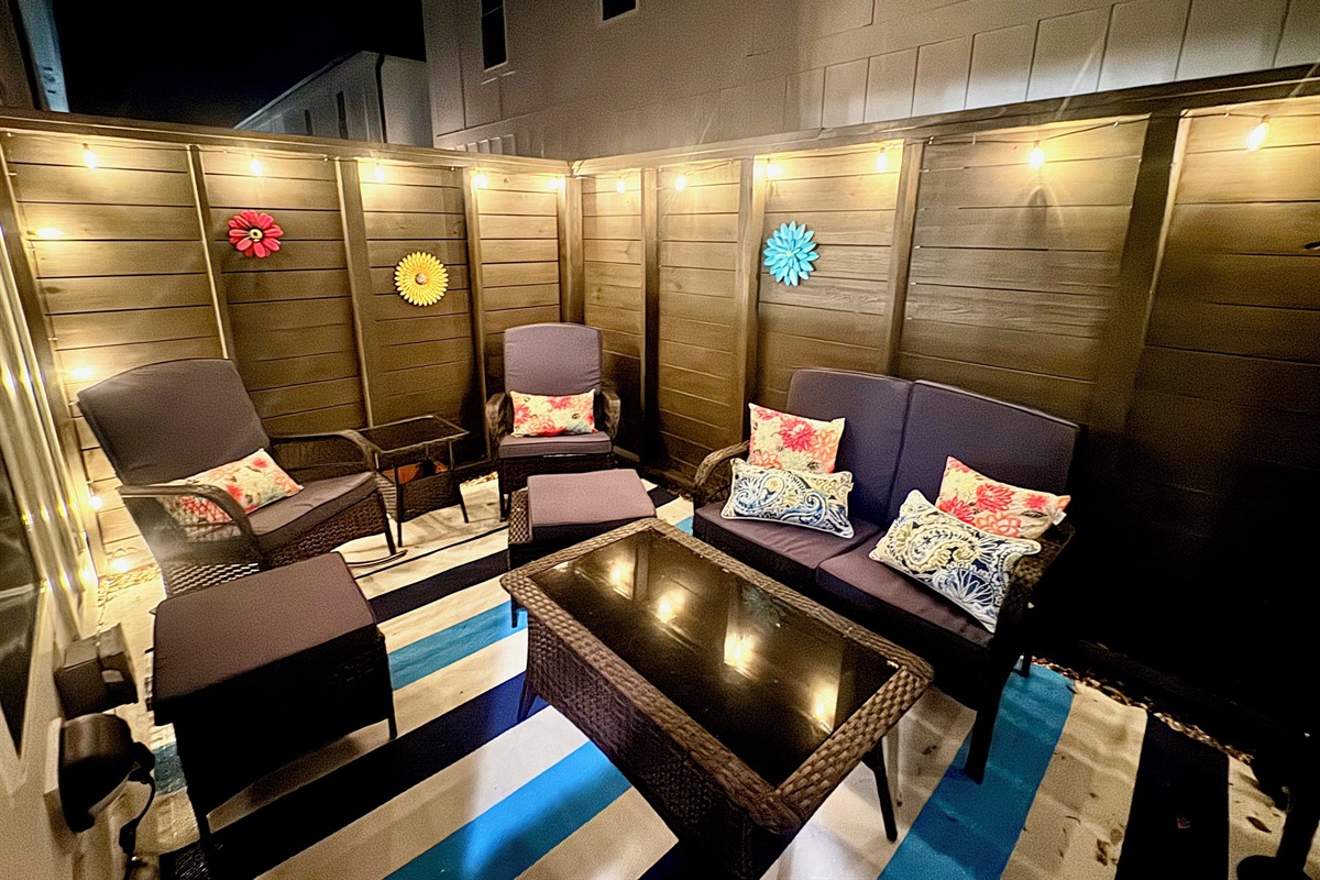 Night view of back porch with seating