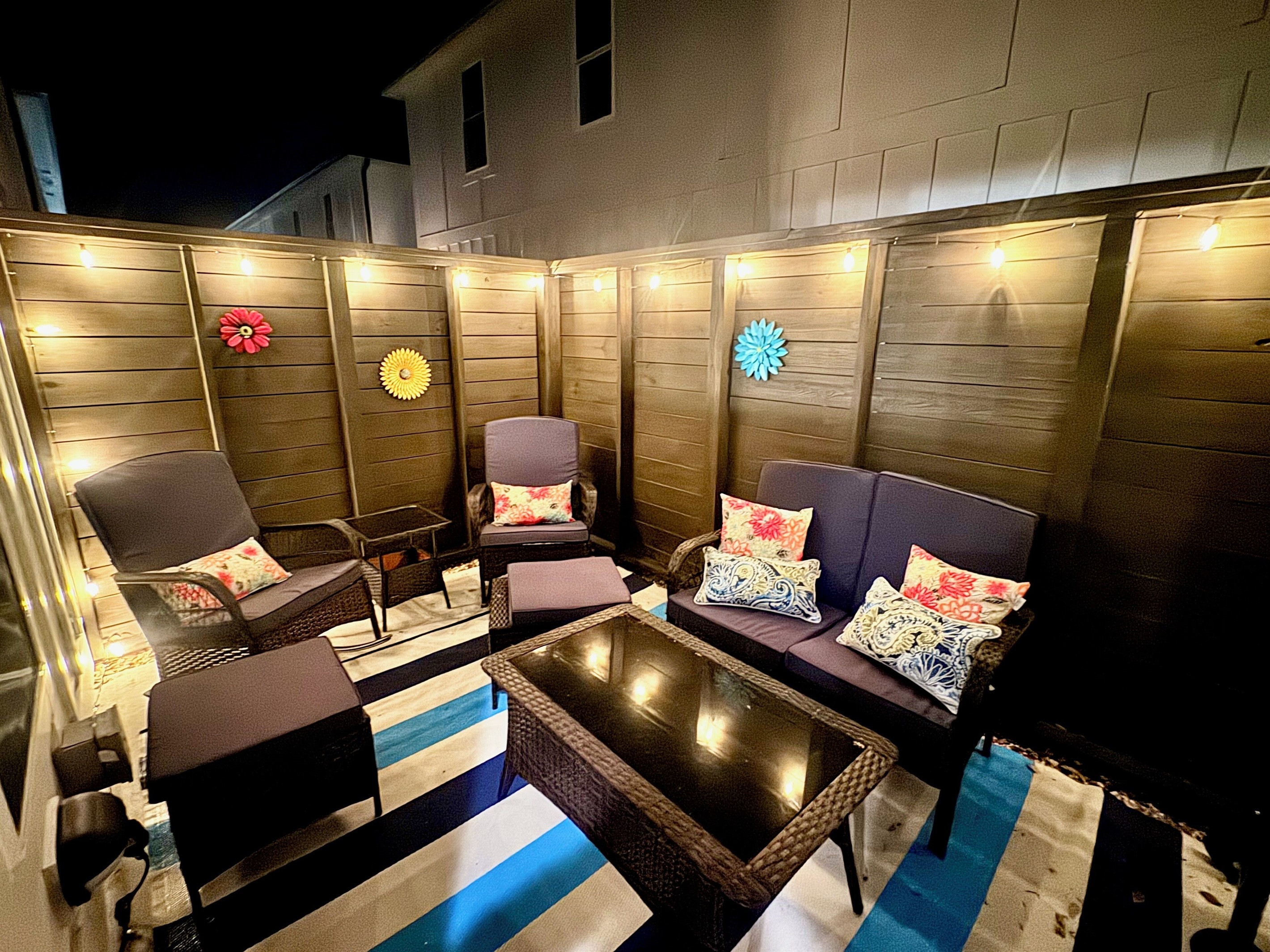 Night view of back porch with seating