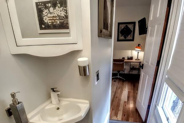 "Hirs" bedroom suite also includes a corner cabinet over the bathroom sink