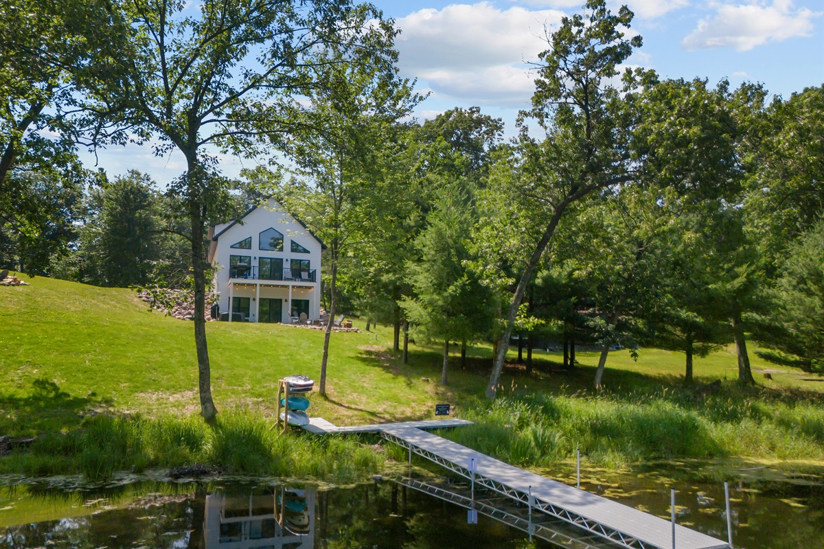 Whether you're lounging in the sun, playing yard games, or enjoying a picnic, the spacious yard has room for it all.