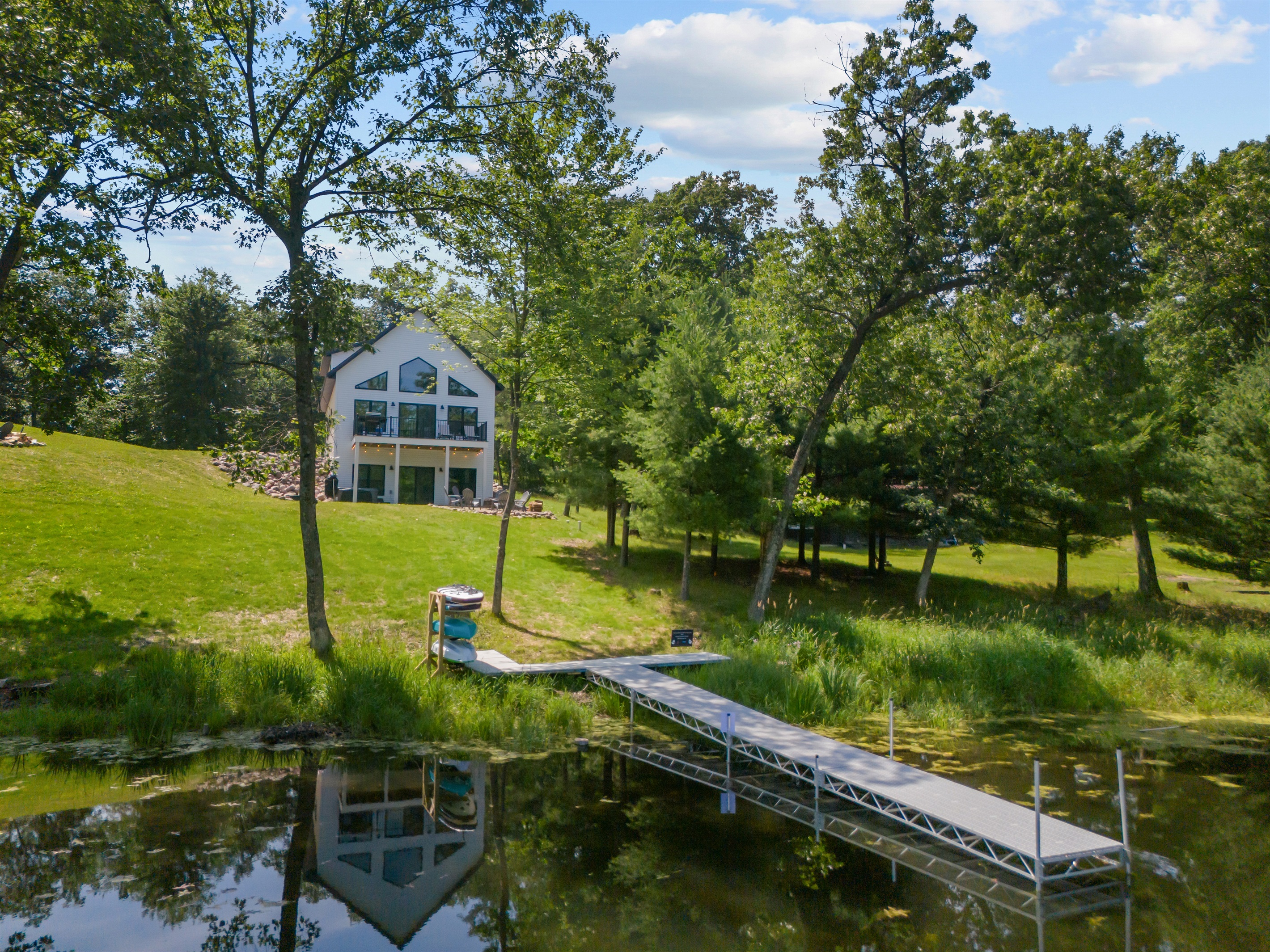 Whether you're lounging in the sun, playing yard games, or enjoying a picnic, the spacious yard has room for it all.