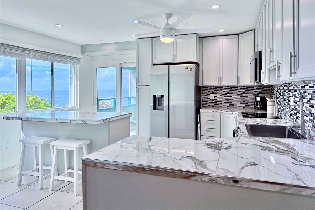 Open plan kitchen with views from every window