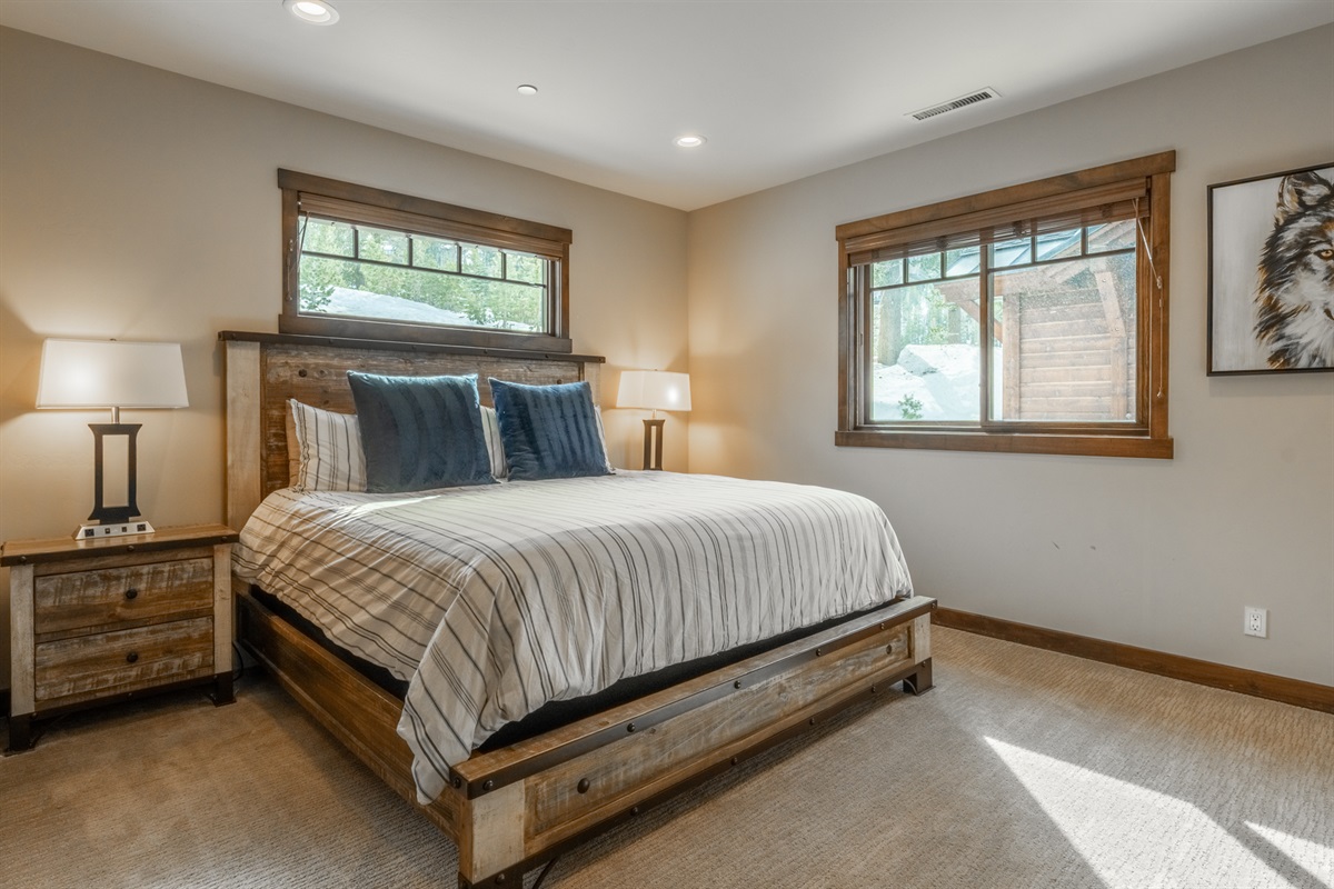 With an attached bath and generous light, this second primary bedroom at Double Black ensures comfort and privacy for couples or additional adult guests.