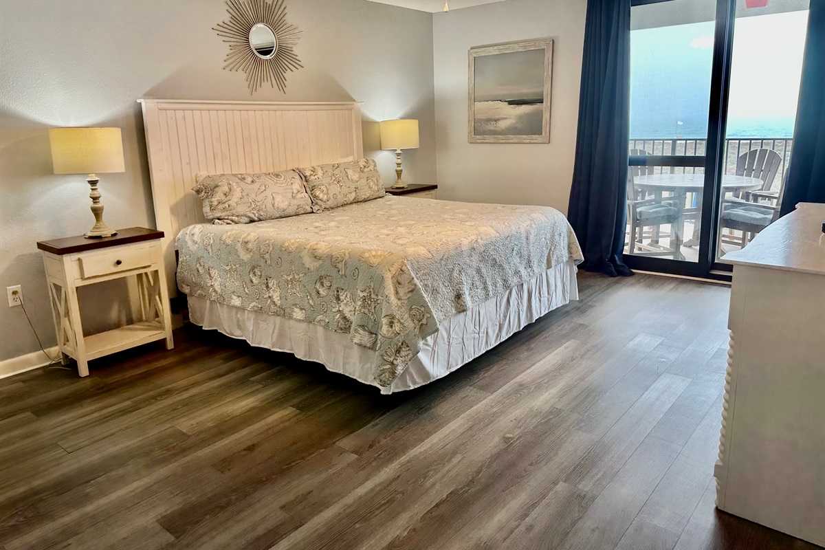 The master has a king-sized bed for ultimate relaxation!  And, there is an entrance to the gulf-front balcony from this room!