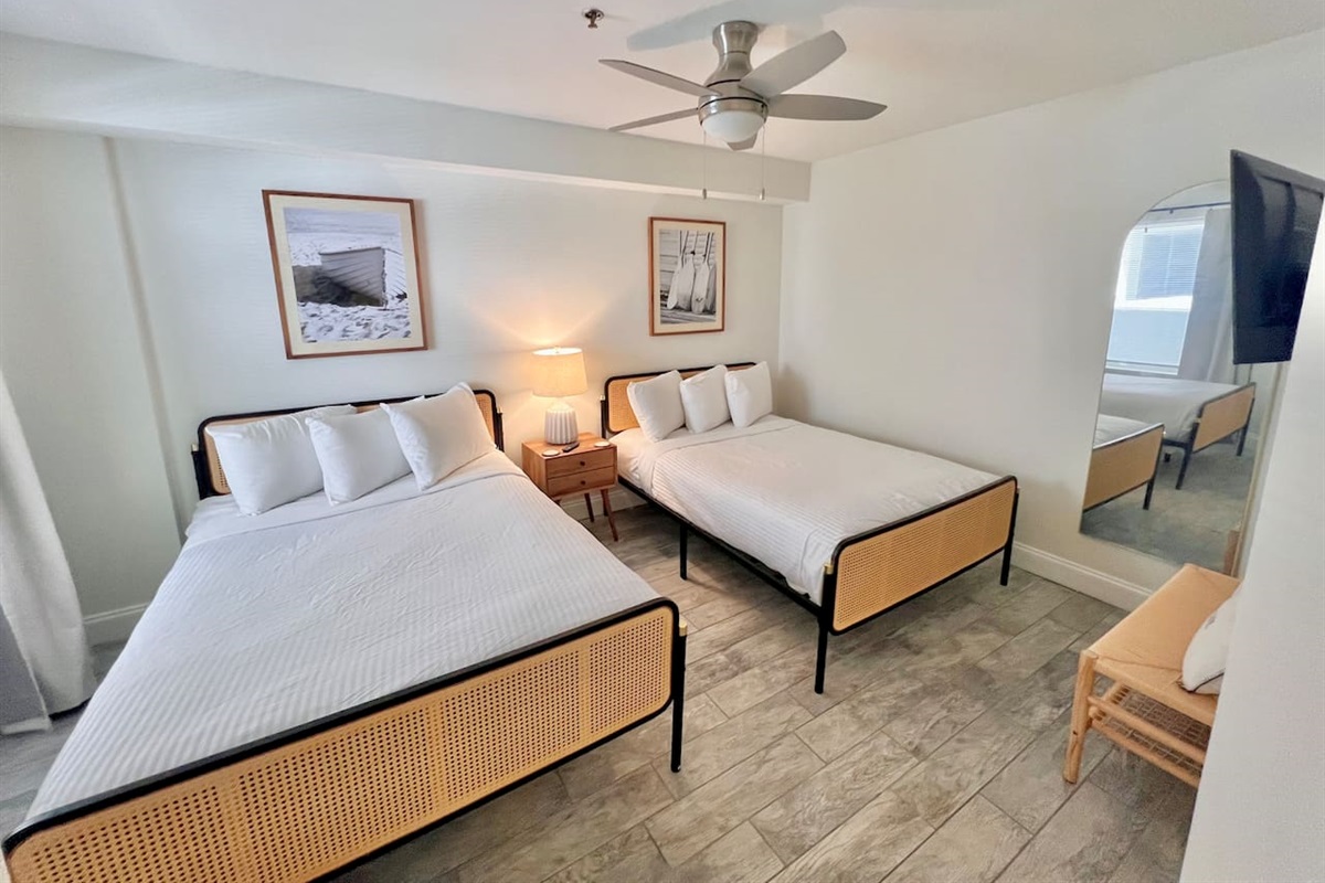 2 full size beds and a smart TV that swivels on the wall for best angle 