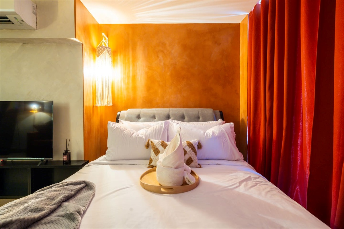 Create your favorite mood with pendant lighting and blackout curtains.