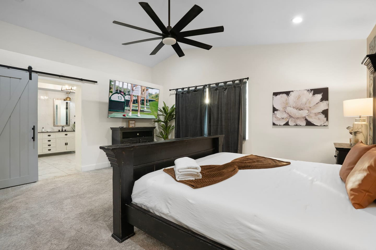 Moody elegance paired with an ensuite bath just steps away.