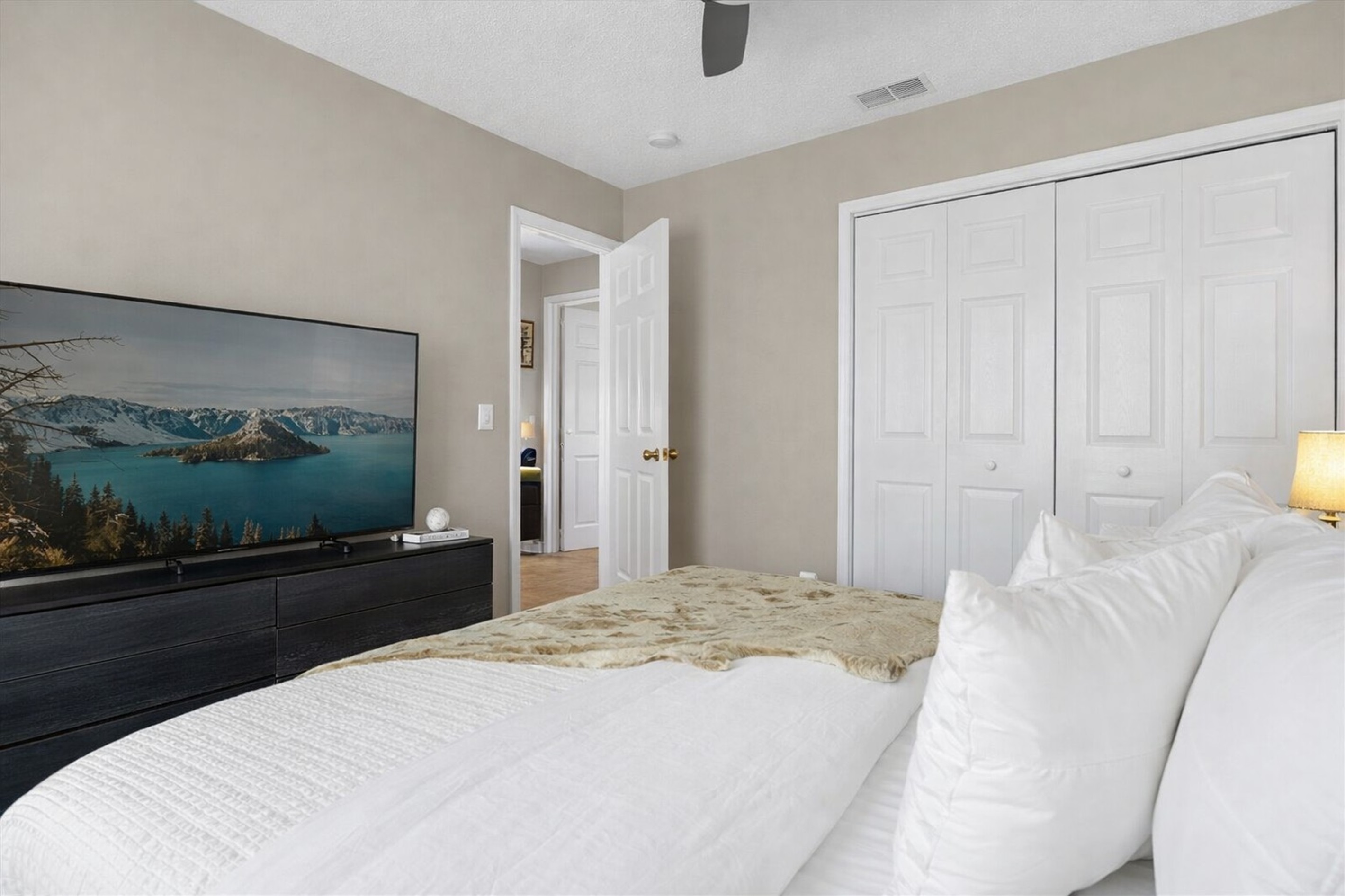 Relax in this bright KING bedroom featuring a 50" Roku television for streaming all of your favorite shows. 