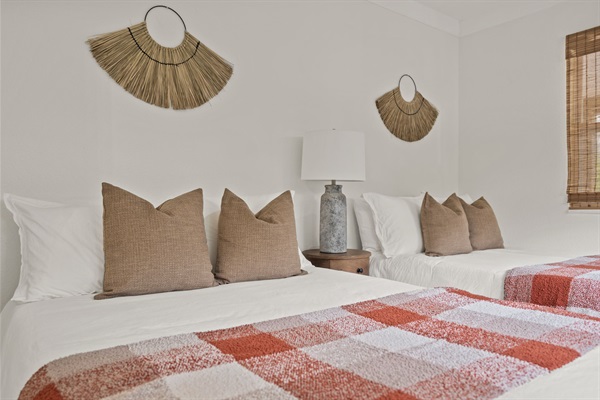 Two full-sized beds perfect for kids or friends.