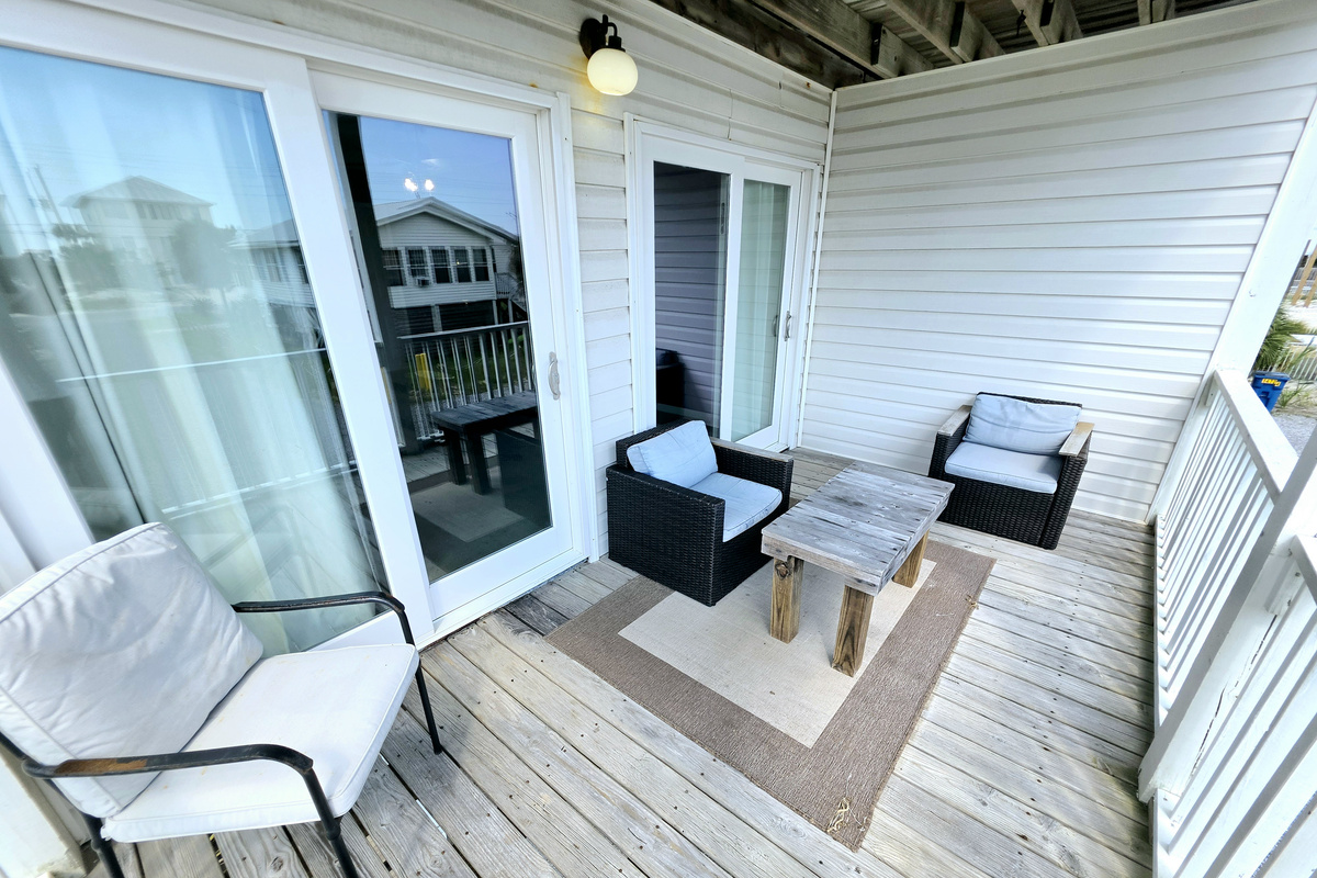 Hideaway side – Covered balcony seating just off the living room