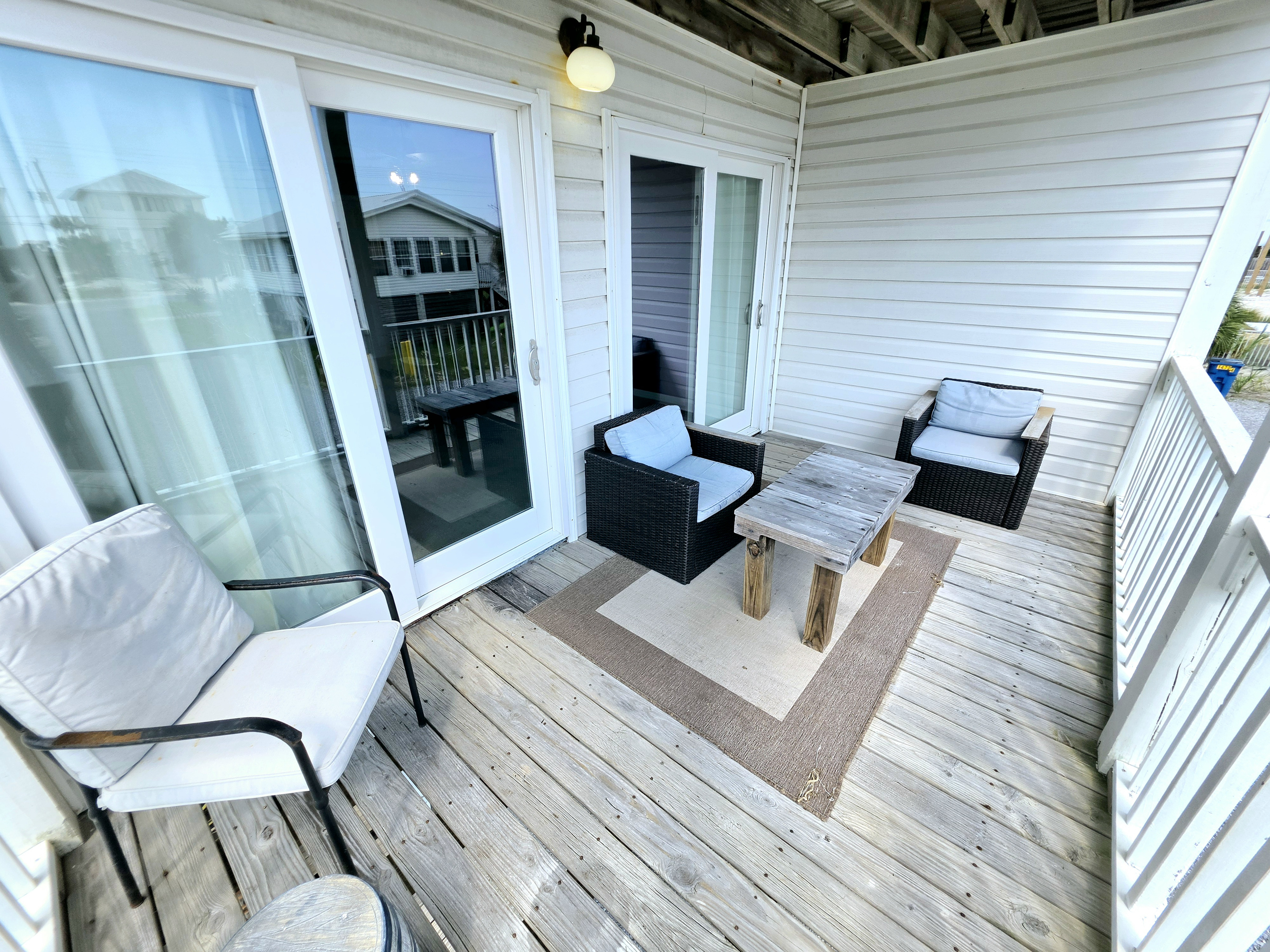 Hideaway side – Covered balcony seating just off the living room