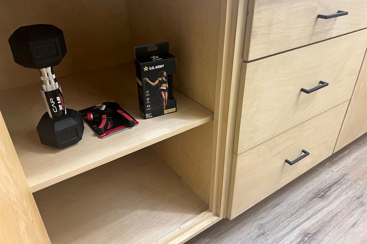 Small workout items and drawer storage available for guest use.
