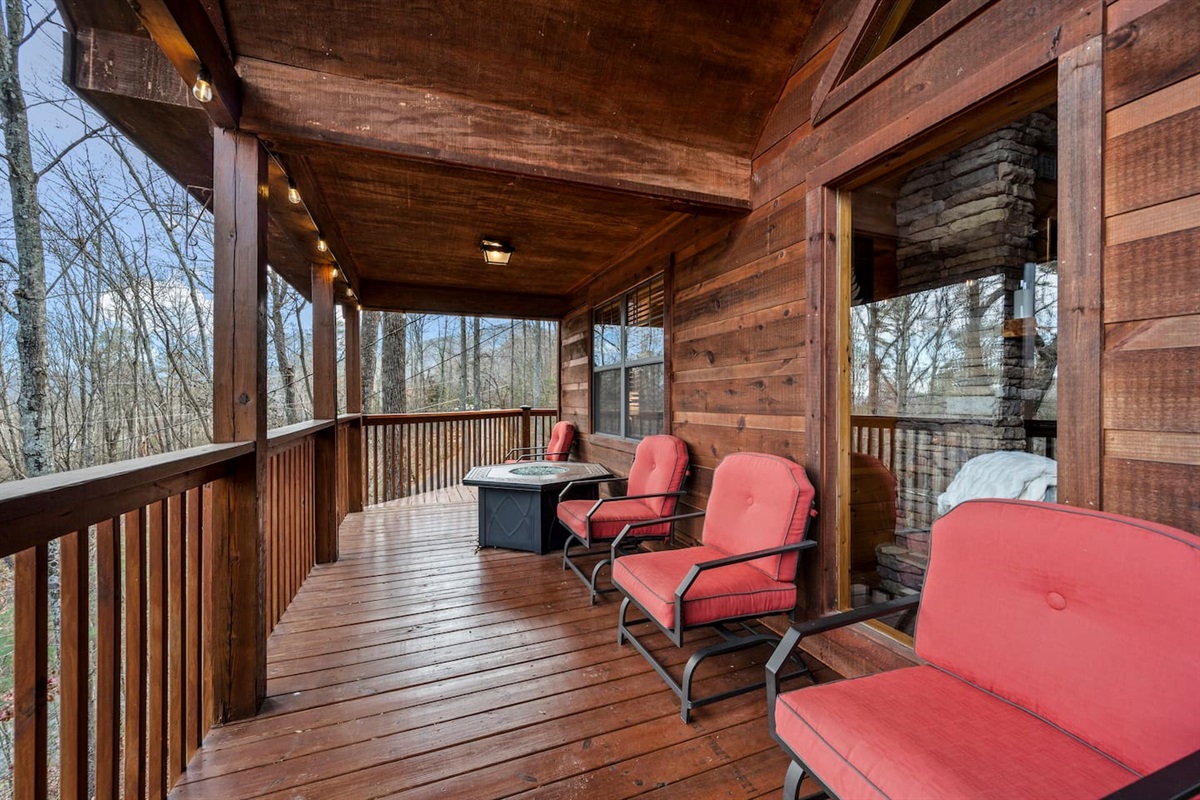 Main level deck with fire table.  Winter view.