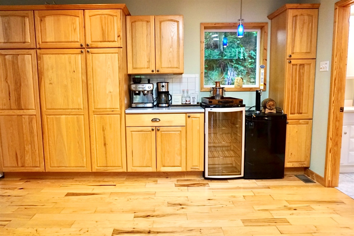 Whip up culinary delights in this sunlit wood-filled kitchen with modern appliances!