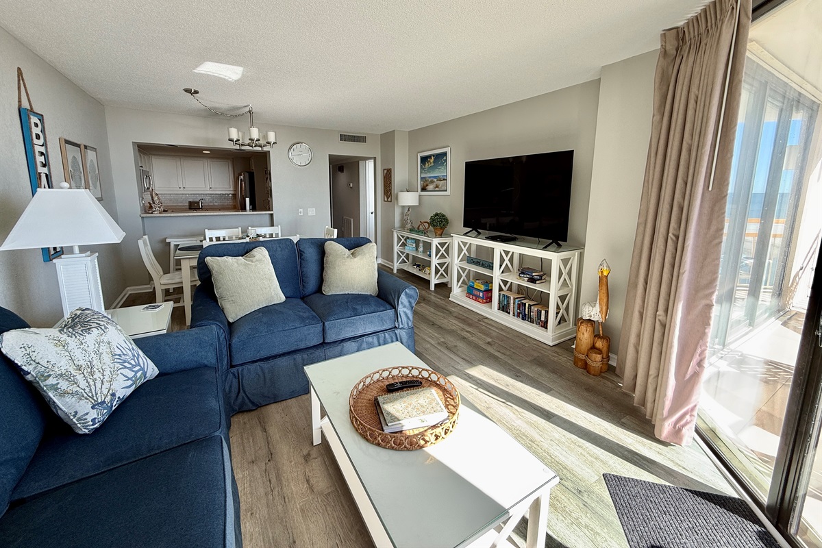 Living Room with LVT Flooring Throughout and Large Smart TV