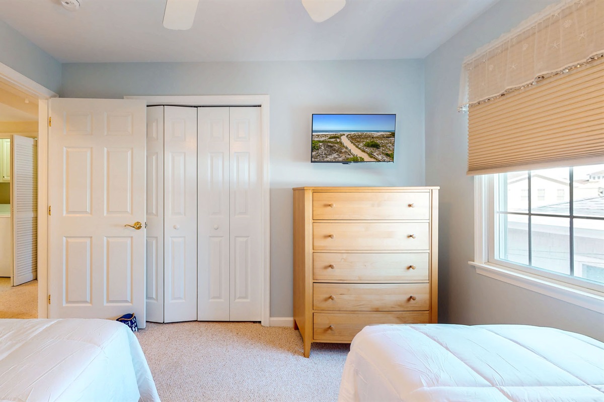 Two twin beds with flatscreen TV