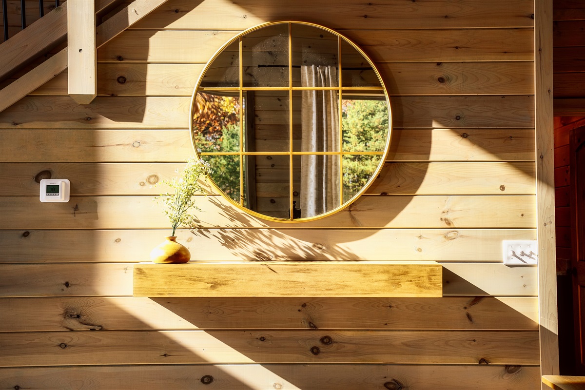 Circle mirror with a sleek floating table underneath. Clean, modern, and perfect for getting ready.
