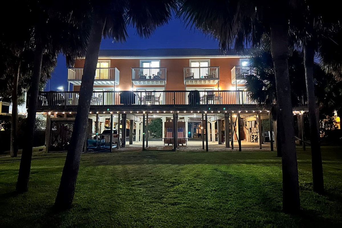 Cozy “Just Beachy” getaway with tropical vibes and glowing evening ambiance in Gulf Shores, AL.