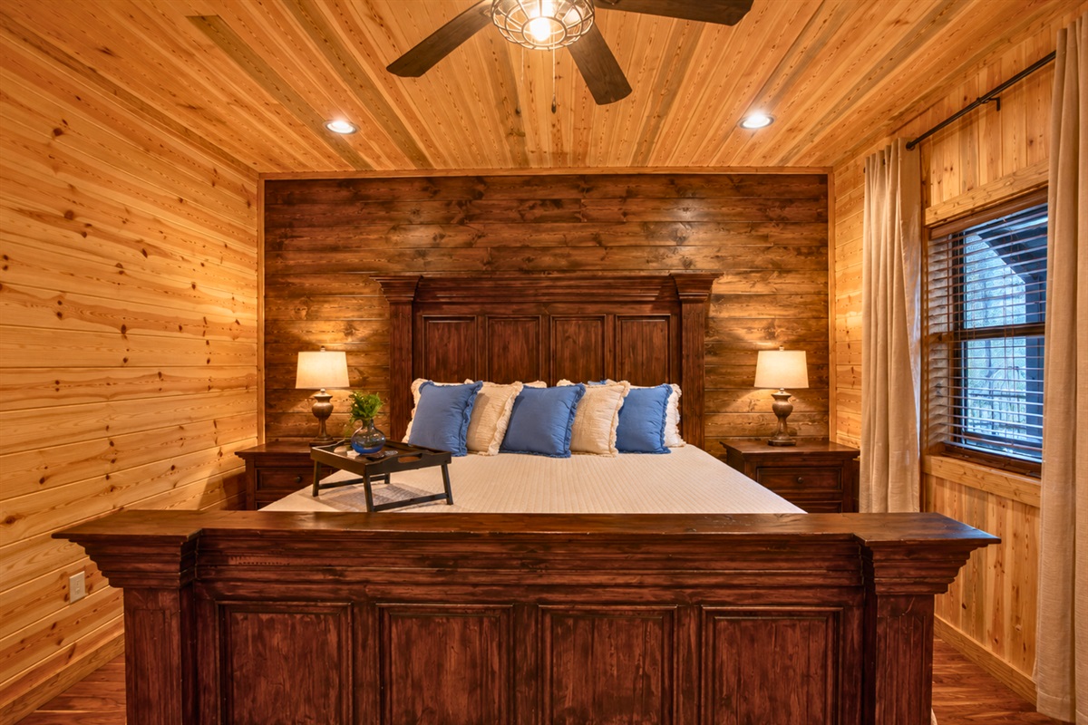 Rich wood walls and soft lighting help create a peaceful retreat where it&rsquo;s easy to settle in and relax.