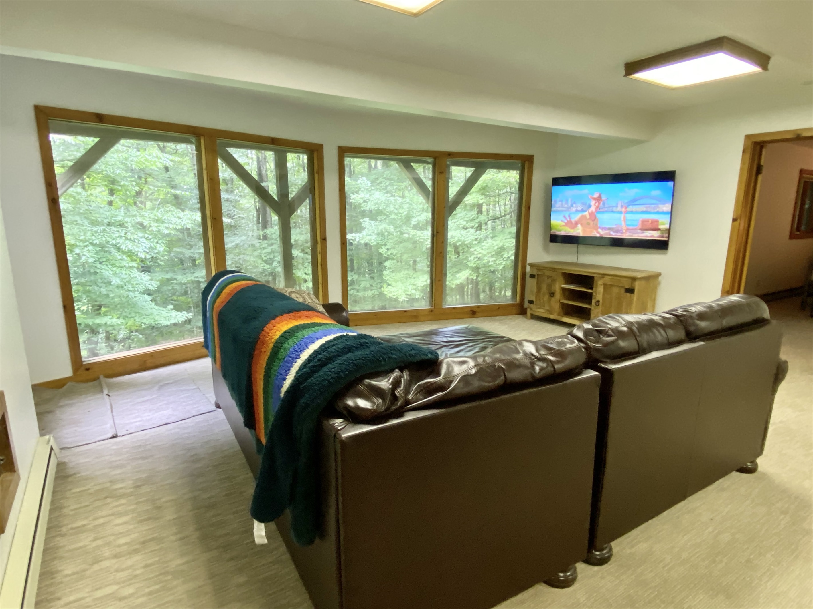 Basement with a 65 smart TV perfect forr the kids or game days.