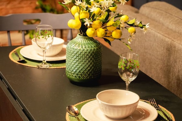 Set the table with a cozy setup and fresh flowers – perfect for a quiet meal.