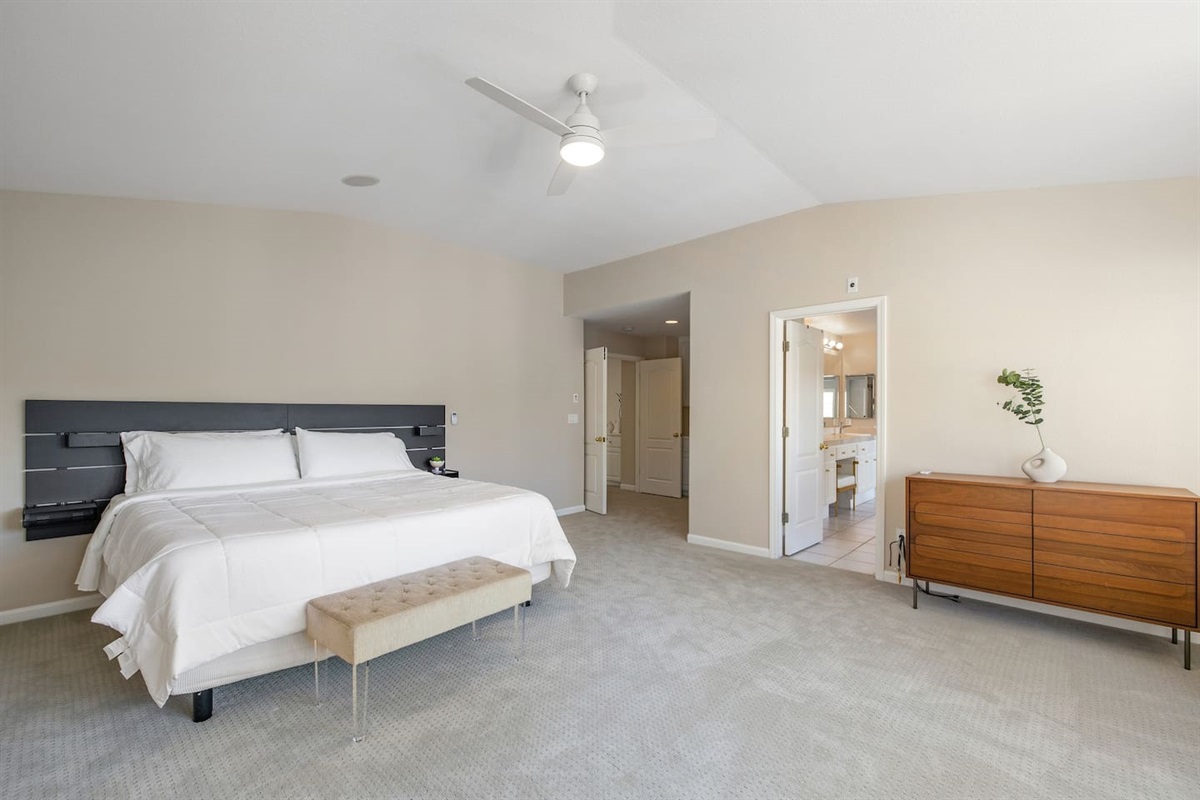 Comfortably sleep in our master's bedroom with an ensuite bathroom and a king-size bed